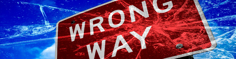 Wrong Way Sign with Broken Glass