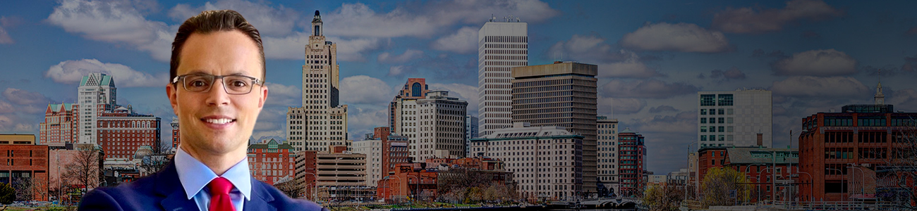 David Tapalian with the Providence Rhode Island Skyline with a dark filter in the background